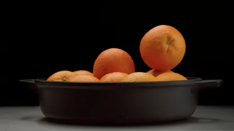 Closeup of oranges on black background Stock Footage 86013759