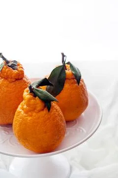 Closeup of oranges on a plate Stock Photos