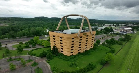 Closeup orbiting flight viewing a building that resembles the company product Stock Footage 335671262