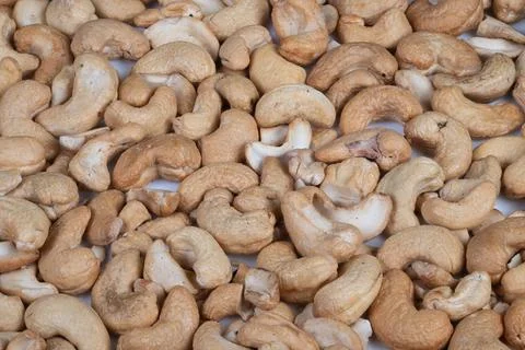 Closeup of organic cashew nut pattern emphasizing curves and texture. Detailed m 스톡 사진