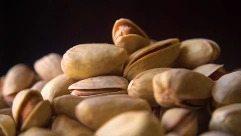 Closeup of organic roasted pistachios Stock Footage 306405881
