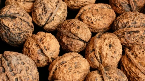 Closeup Organic Unbleached Walnuts  Background tracking shot Stock Footage 115982677