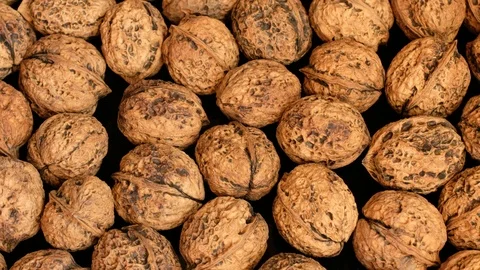 Closeup Organic Unbleached Walnuts In Rotation Stock Footage 115902506