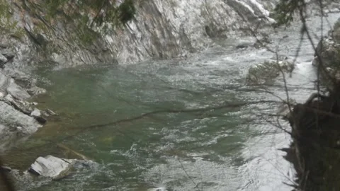 A closeup of the Ottauquechee River running through the Quechee Gorge Stock Footage 166481313