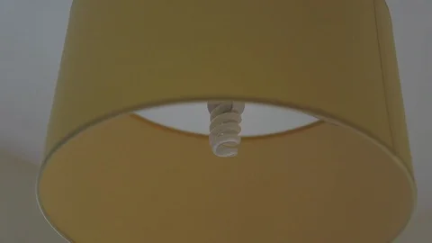 Closeup overhead of turning on a lamp Stock Footage 118597542