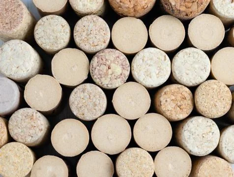 Closeup overhead  view of different used wine cork stoppers on  table . Stock Photos