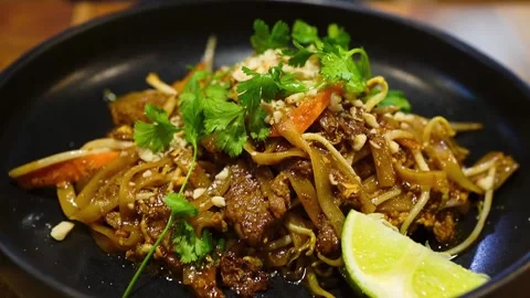 Closeup of Pad Thai, one of most popular dish dishes in Thai cuisine Stock Footage 310912540