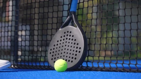 Closeup of a padel player picking up the racket and the ball. Stock-Footage 240731196