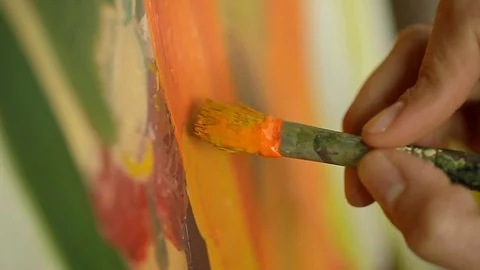 Closeup of Painter with brush on canvas in slow motion Stock-Footage 126361408