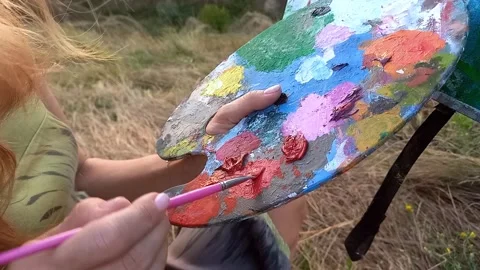 Closeup of palette with multi-colored paints and brush. 스톡 동영상 250818541