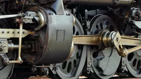 Closeup pan of Big Boy steam locomotive's massive driving wheels and mechanics Vídeo Stock 159260495
