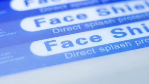 Closeup pan of blue stack of face shields Video stock 145171749