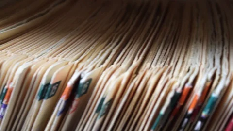Closeup Pan of File Folder Medical Records (no identities shown) Stock Footage 113361904