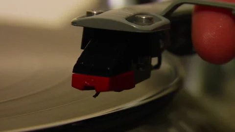 Closeup Pan On Needle Dropping On Record And Picked Back Up Stock-Footage 144423827
