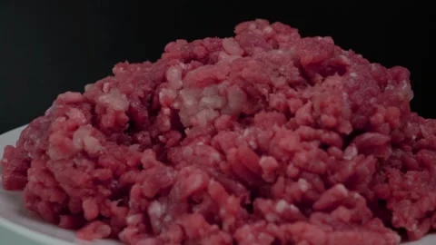 Closeup Pan Right of Raw Ground Beef Meat on Plate with Black Background 動画素材 134322898