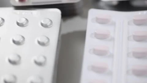 Closeup pan shot of pills in their blisters Stock Footage 156043004