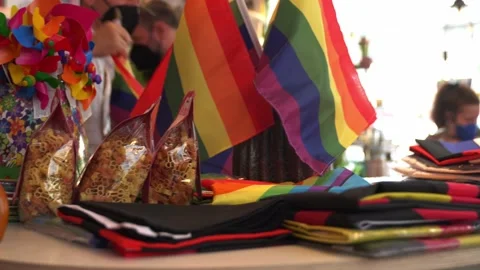 Closeup pan shot of pride merch in shop Stock Footage 159660383
