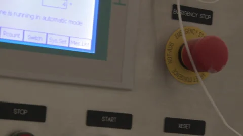 Closeup pan shot from a red button to a flat panel display. Stock Footage 50521769