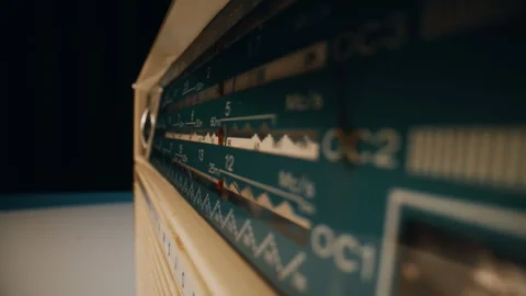 Closeup panel radio channels with adjustment knob. Macro analog signal receiver Stockbeeldmateriaal 332668668