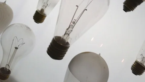 Closeup panning of various antique light bulbs in a science lab Stock Footage 111119320