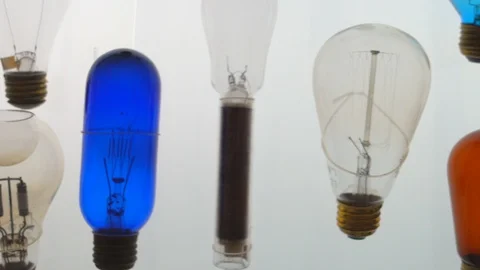 Closeup panning of various light bulbs in a science lab Stock Footage 111119255
