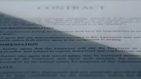 Closeup paper contract text under sun rays in office table. Business document Stock Footage 332417162