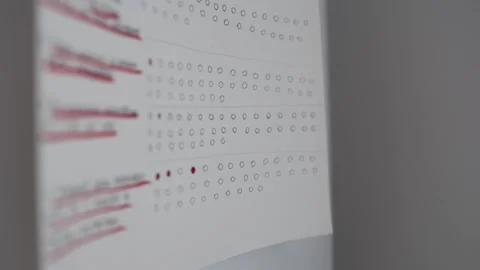 Closeup of a paper habit tracker with rows of empty and filled circles pinned to Stock Footage 312198110