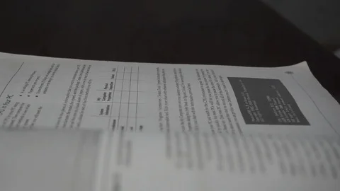 Closeup partial blurry short page book turning Stock Footage 112655640