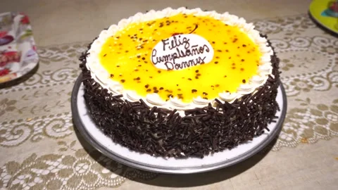 Closeup of a passion fruit and chocolate cake on a birthday. Stock-Footage 154814940