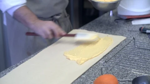 Closeup of pastry chef making roll cake with pastry dough Stock Footage 107545259