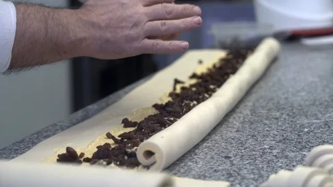 Closeup of pastry chef making roll cake with pastry dough Stock Footage 107545423