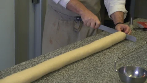 Closeup of pastry chef making roll cake with pastry dough Stock Footage 107545444