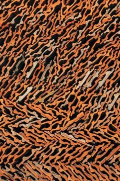 Closeup pattern of stacked old terracotta roof tiles forming an abstract ge.. Foto stock