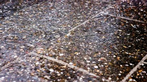 Closeup of pavement in the rain Stock Photos