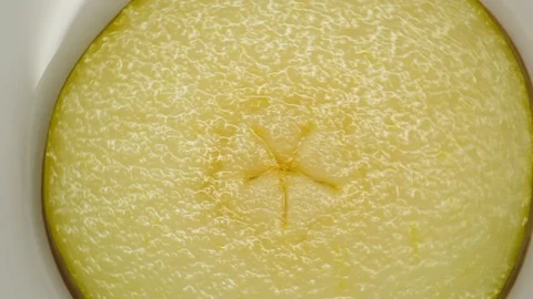 Closeup of pears with water. Rotating on a turntable, on a white background. Stock-Footage 125885235