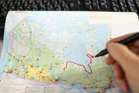 Closeup of pen tip touching location or territory mark drawing on a map Stock Photos
