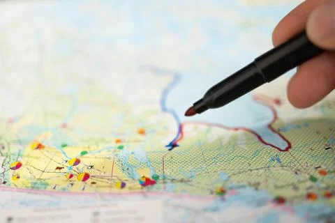 Closeup of pen tip touching location or territory mark drawing on a map Stock Photos