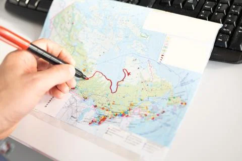 Closeup of pen tip touching location or territory mark drawing on a map Stock Photos