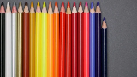 Closeup pencils moving up on gray background. Stop motion Video stock 100299190