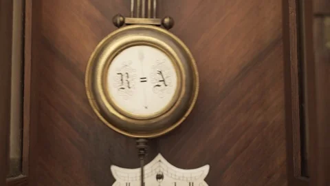 Closeup Pendulum ra Wall Clock Stock Footage 120313111