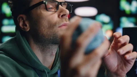 Closeup pensive software developer working computer at server room. Man playing Stock Footage 260242438