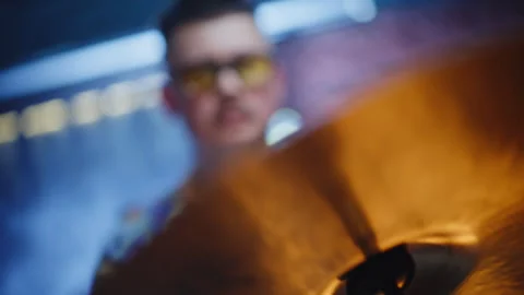 Closeup percussion hardware adjusted by focused male technician in stage space. Stock Footage 334117335