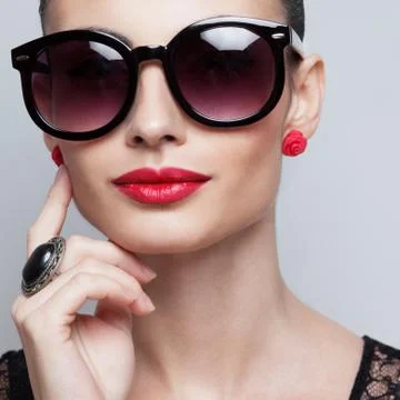 Closeup of perfect model in big rounded sunglasses. text space and copy space Stock Photos