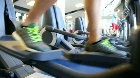 Closeup of person exercising on an elliptical machine Stock Footage 59130387