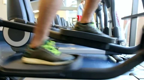 Closeup of person exercising on an elliptical machine Stock Footage 59130388
