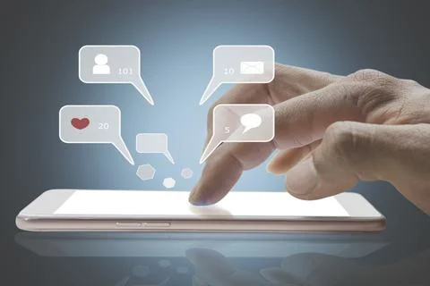 Closeup of person finger hand using a social media chat on a mobile phone w.. Fotos de archivo