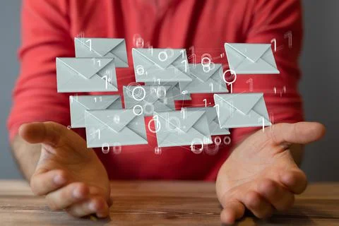 Closeup of a person holding a 3D render of interconnected message envelopes Stock Photos