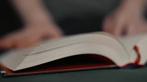 Closeup of a person reading a book. Stock Footage 314834363