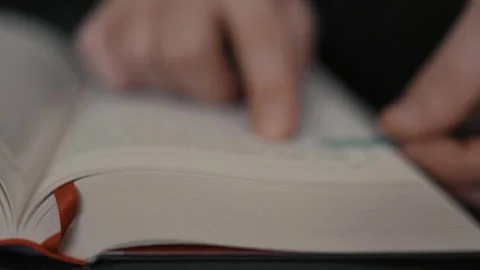 Closeup of a person reading a book. Stock Footage 314834603