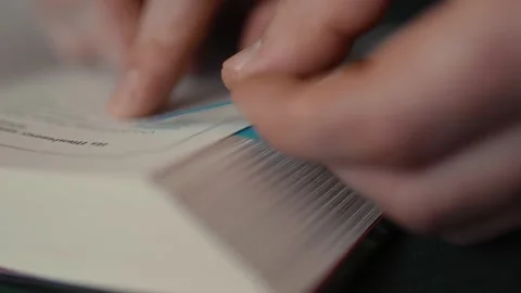 Closeup of a person reading a book. Stock Footage 314834644